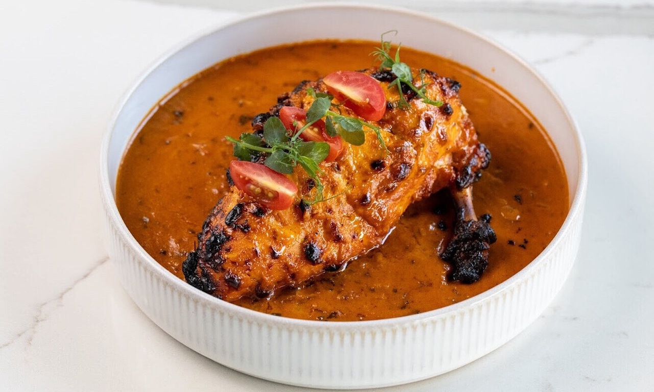 Essence of Kesar signature dishes Dhabba Matka ChikenThalassery Bamboo Chicken BiryaniPaneer Tikka Masala
